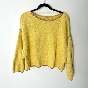 Free People yellow roomy and slightly cropped sweater.